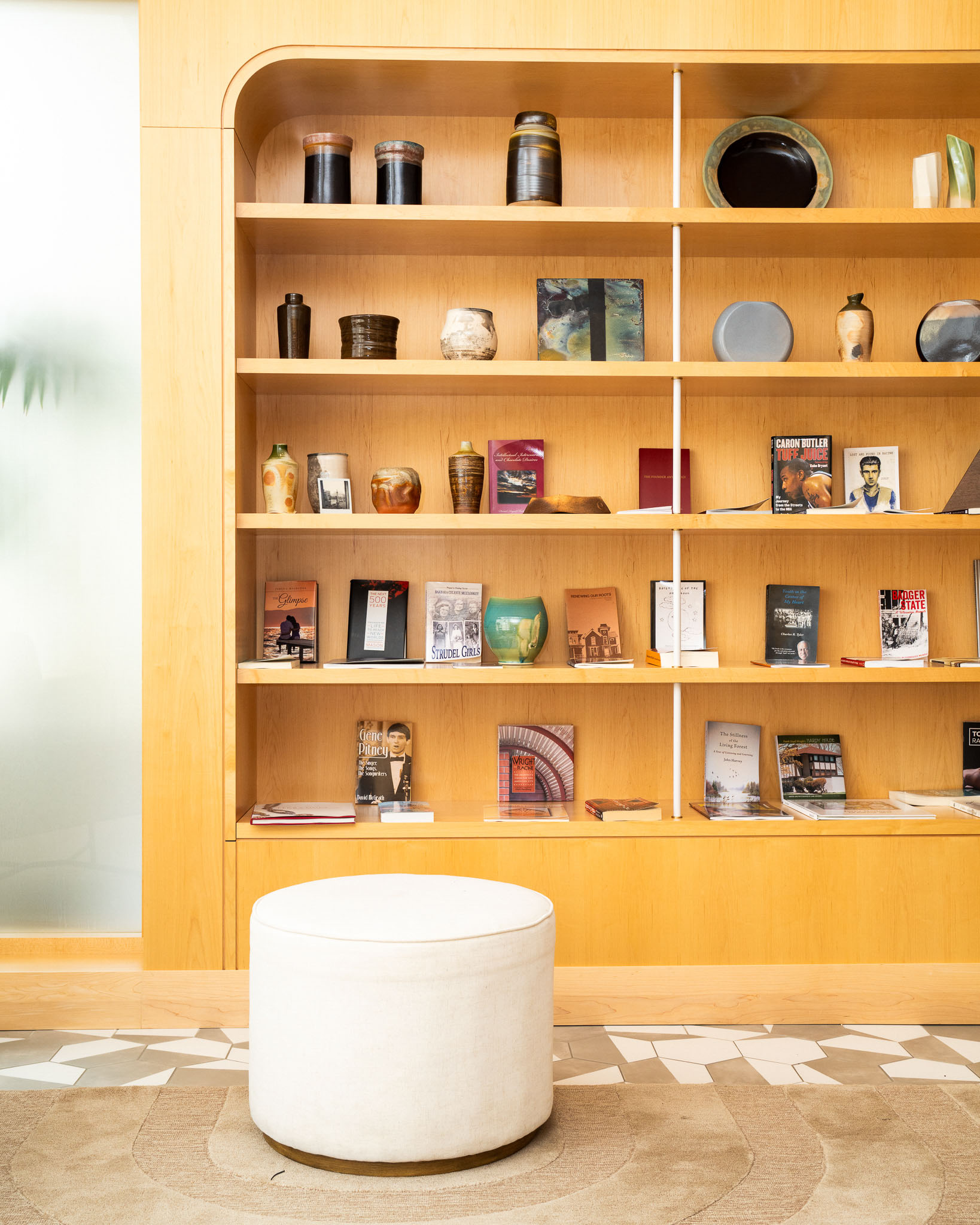 a shelf with books and objects on it