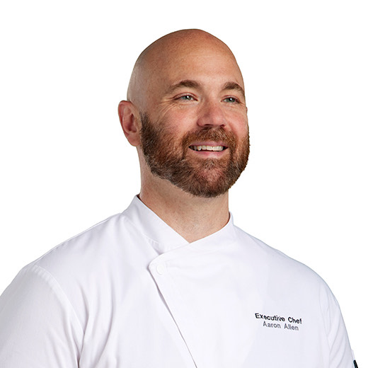 a man in a chef's coat