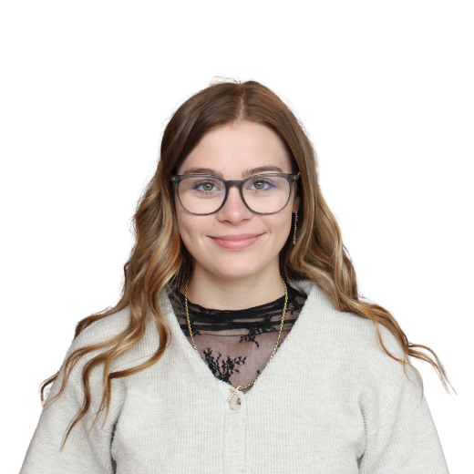 a woman wearing glasses and a sweater