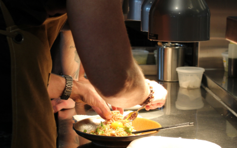 a person preparing food in a kitchen