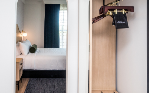 a room with a bed and a gun