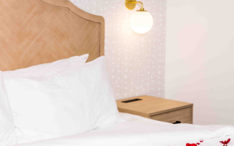 a bed with rose petals on it