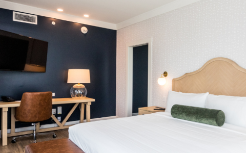 a room with a bed and a tv