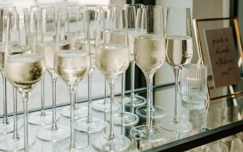a group of champagne glasses on a table