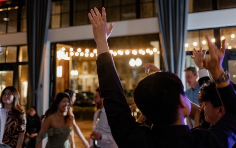 a group of people dancing in a room