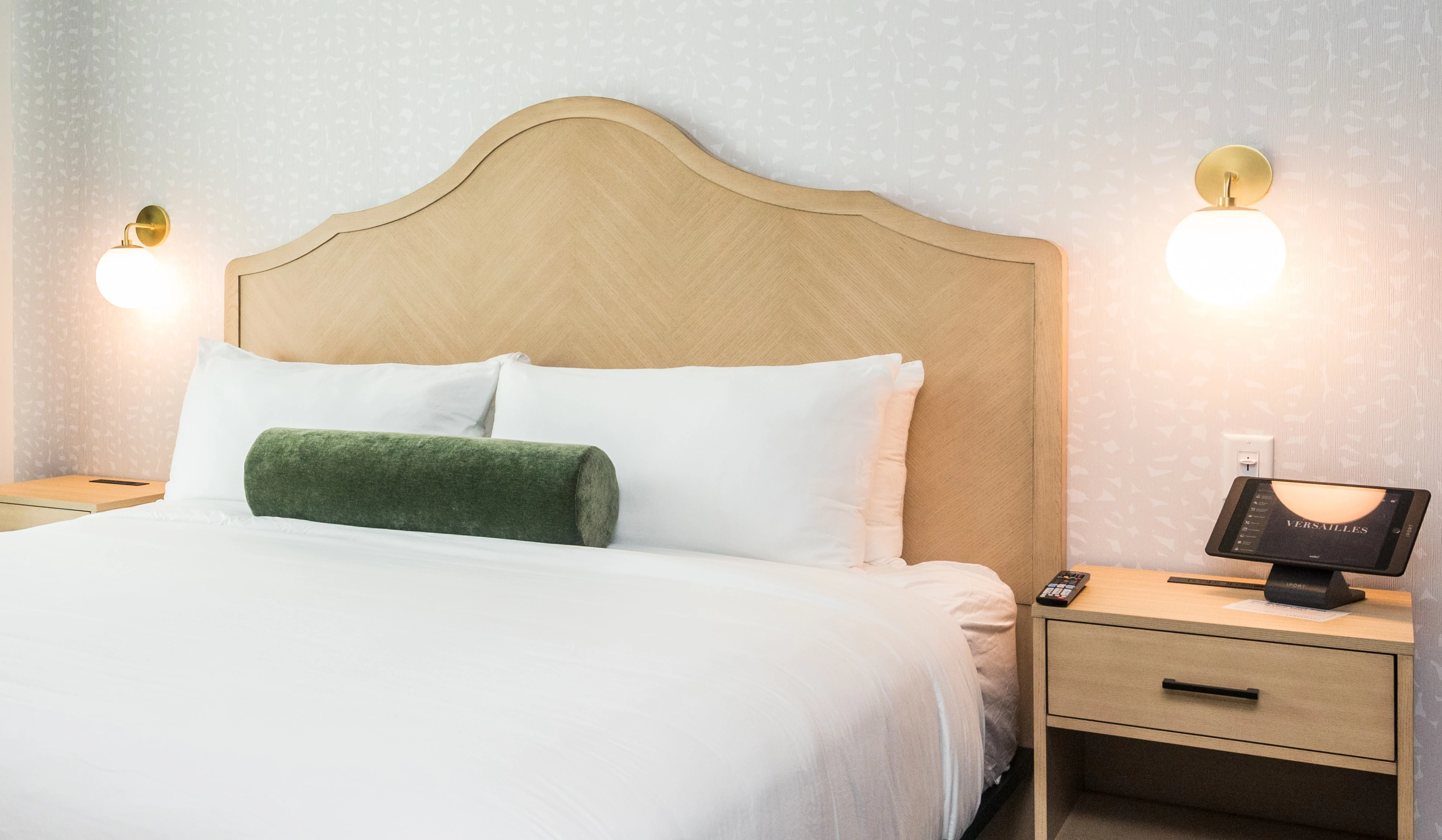 a bed with a lamp and a table