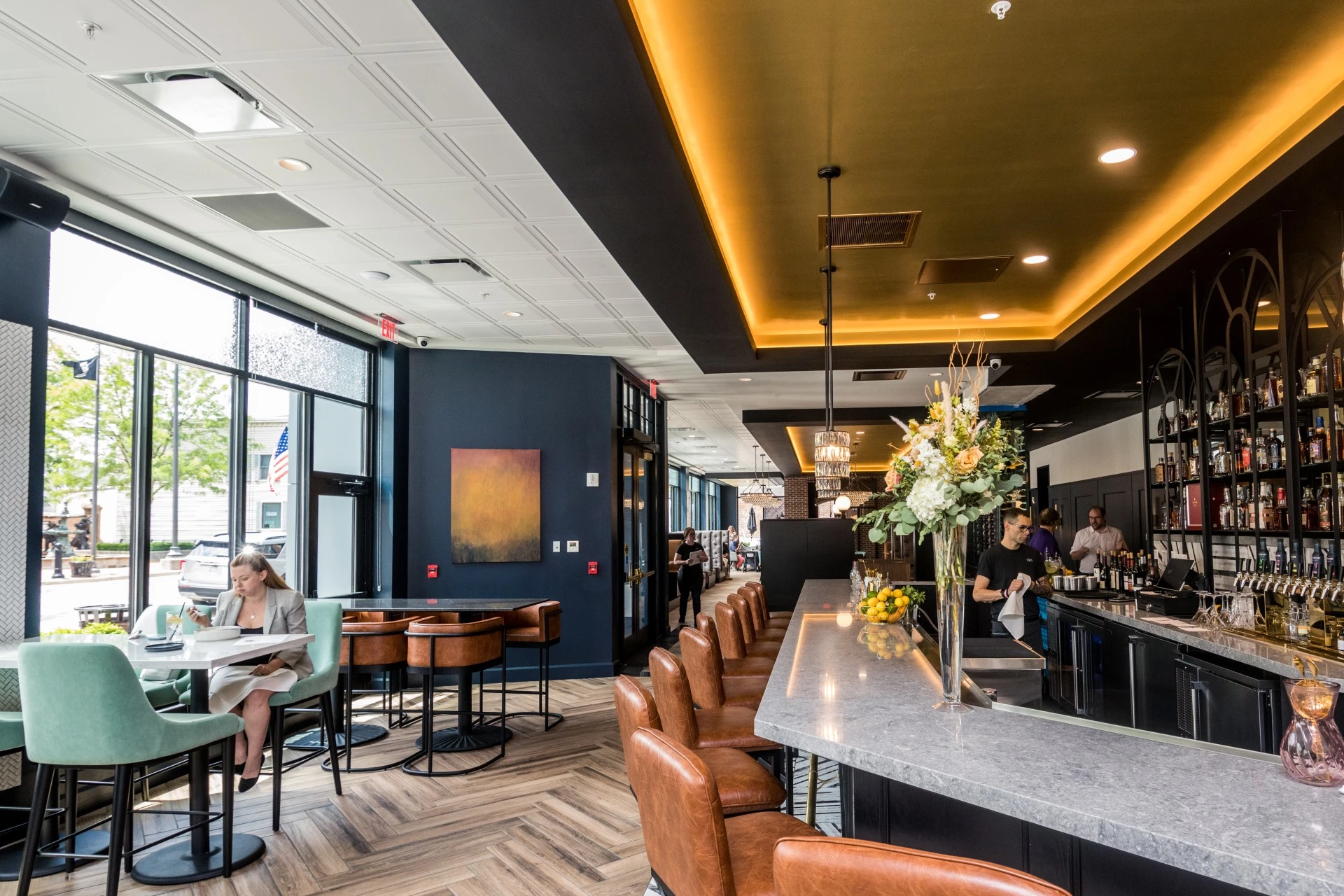 a restaurant with a marble counter and chairs