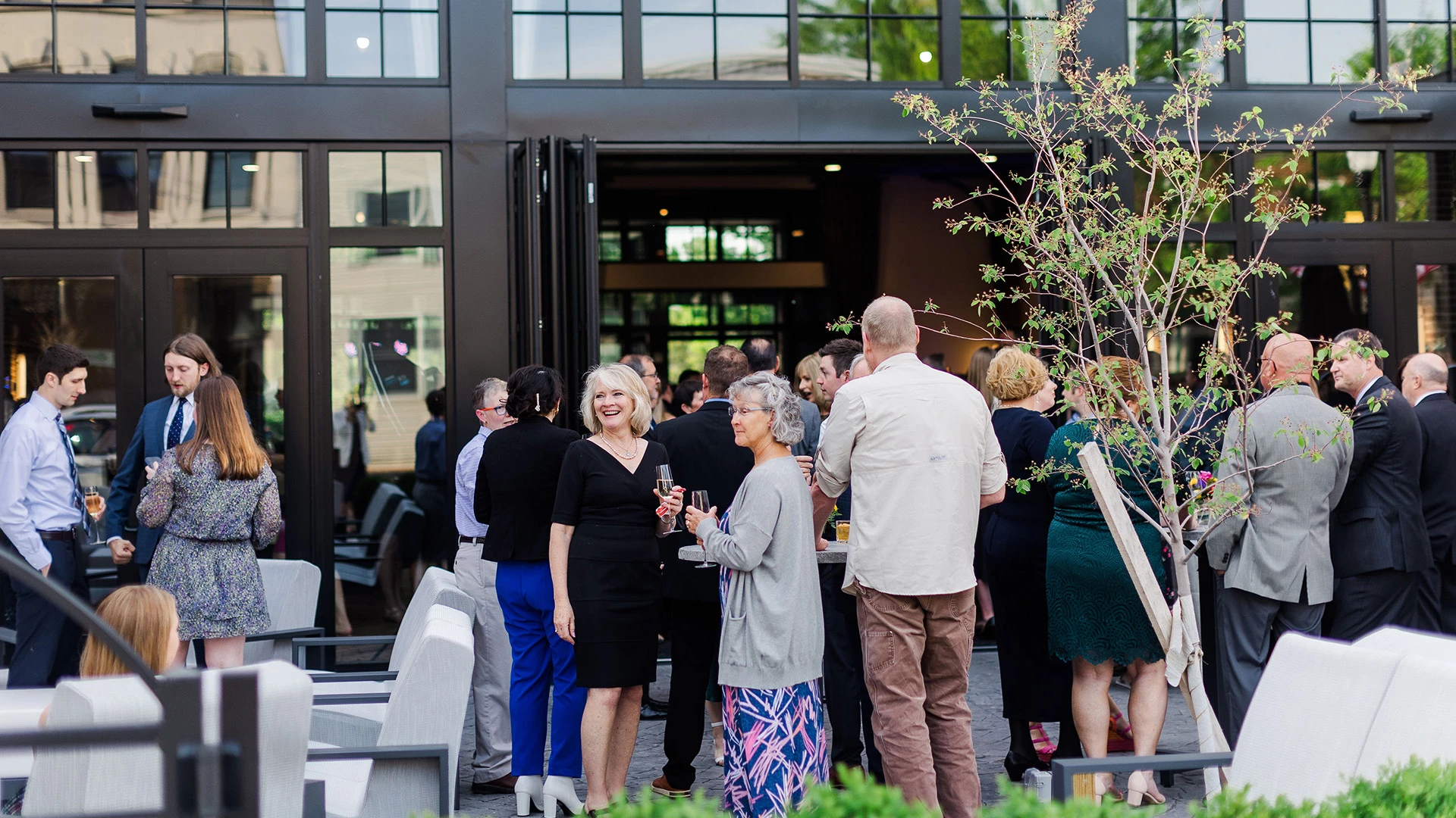 a group of people standing outside a building