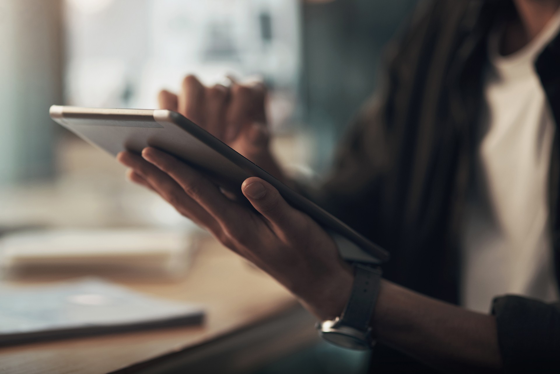 a person holding a tablet