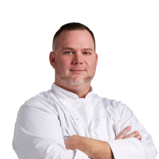 a man wearing a chef's coat