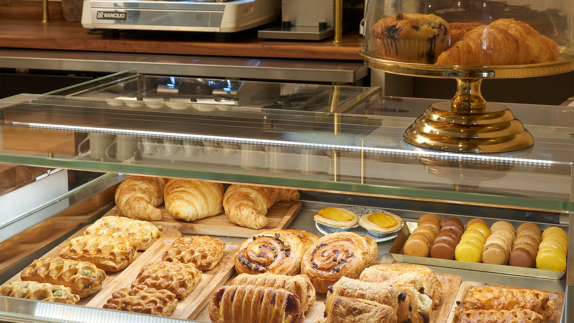 a display case with pastries and pastries