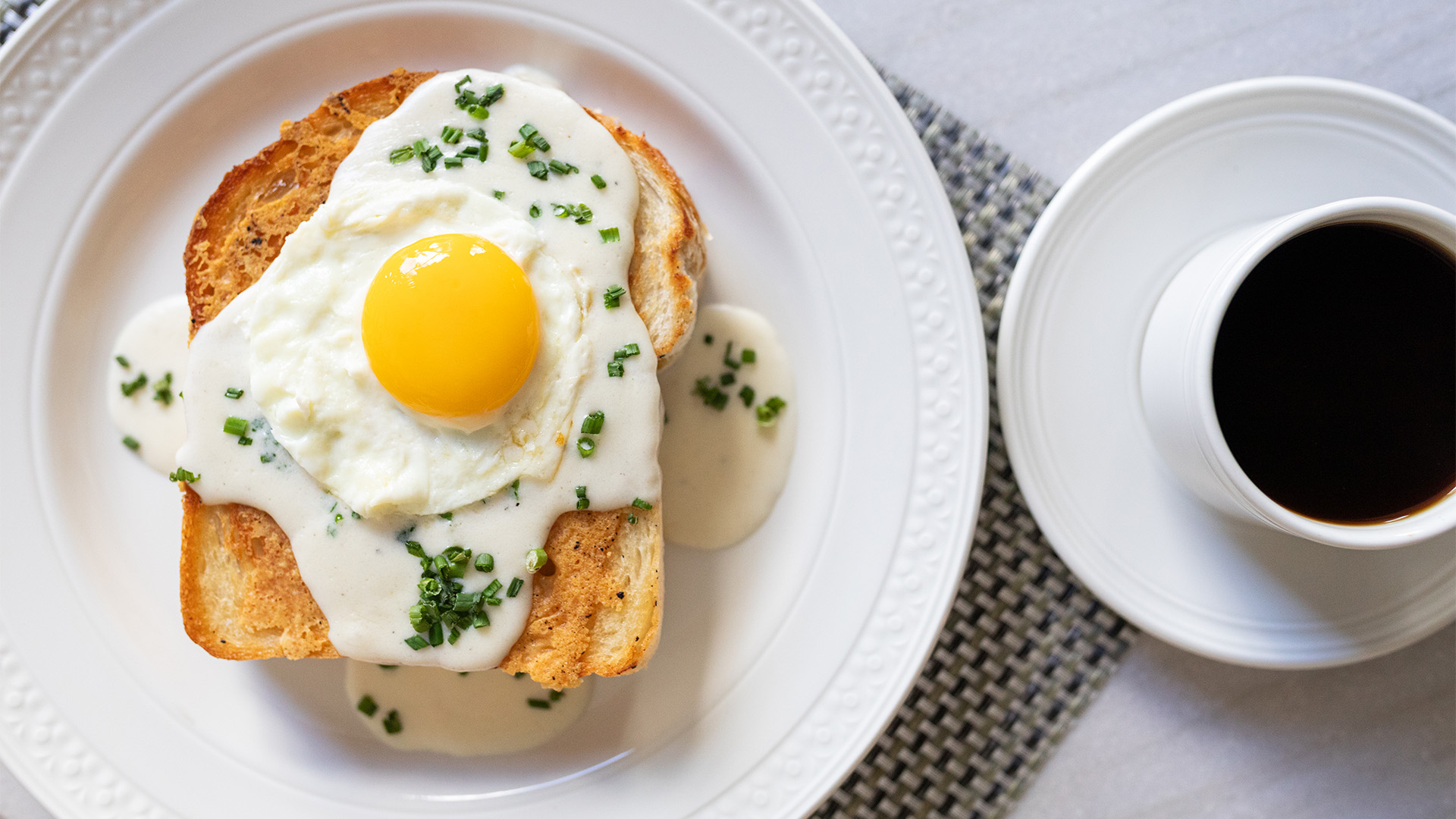 a plate of food with a fried egg on top