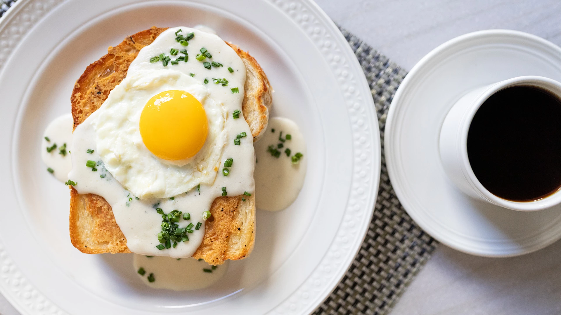 a plate of food with a fried egg on top