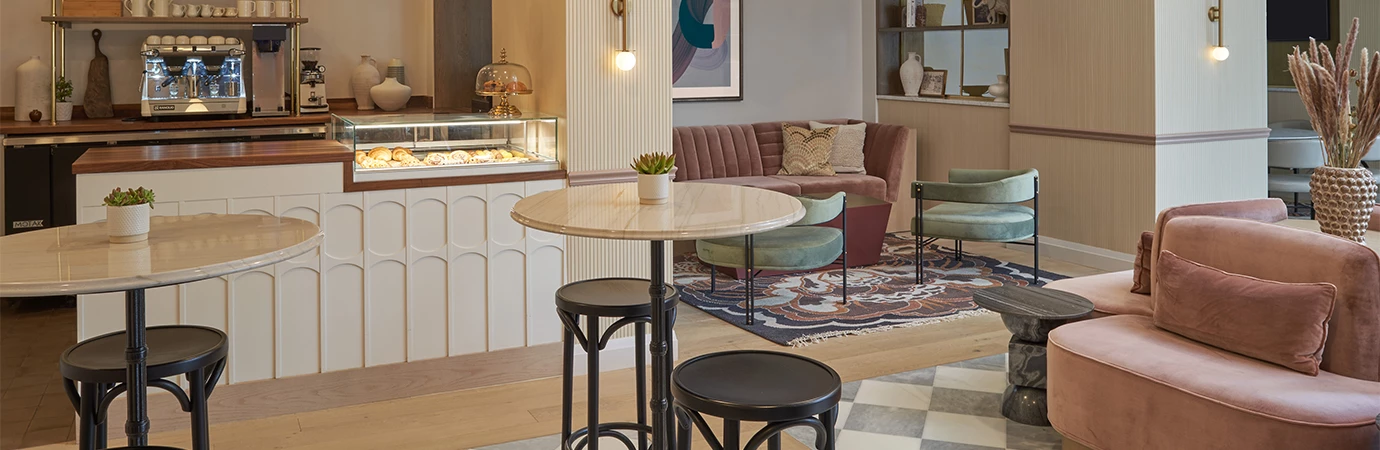 a table and stools in a room