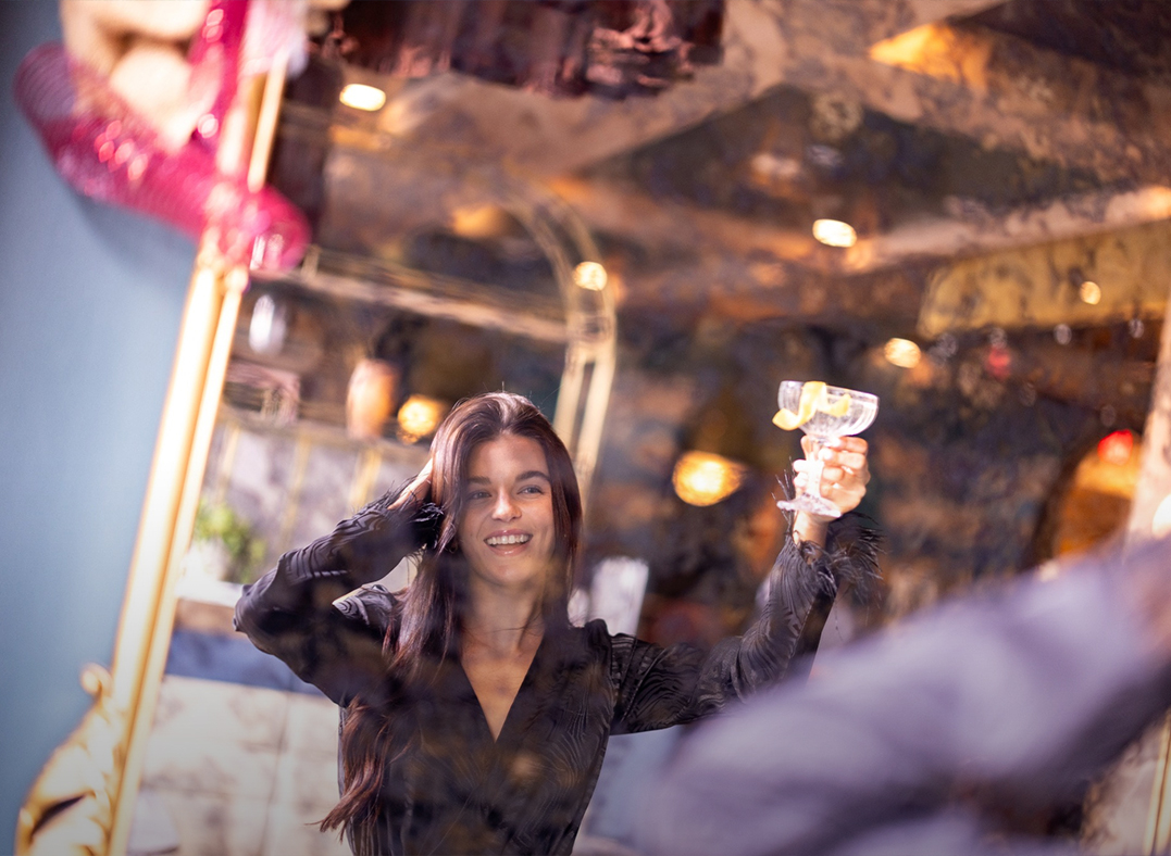 a woman holding a glass