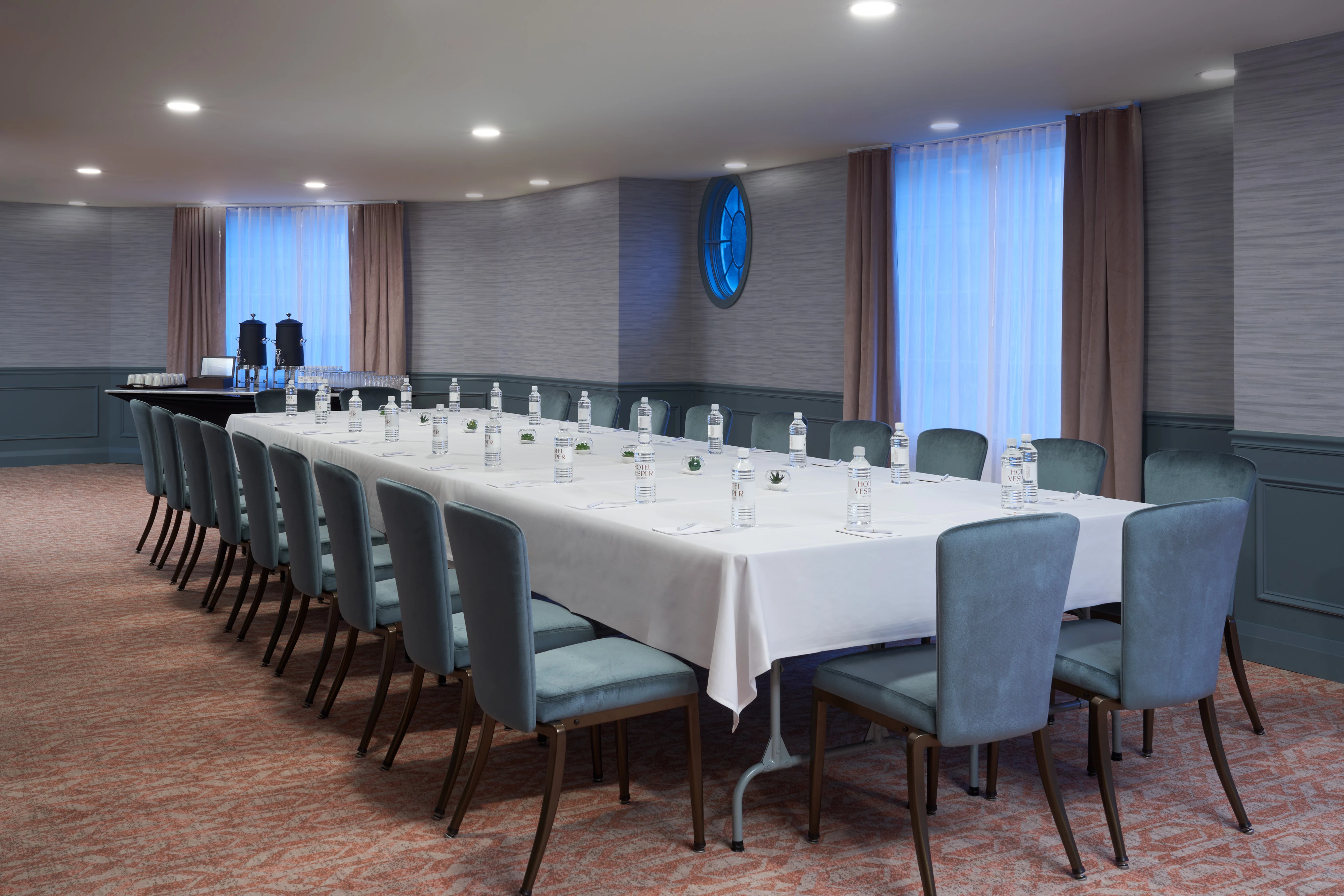 a long table with water bottles on it