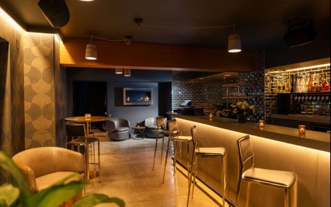 a bar with chairs and tables