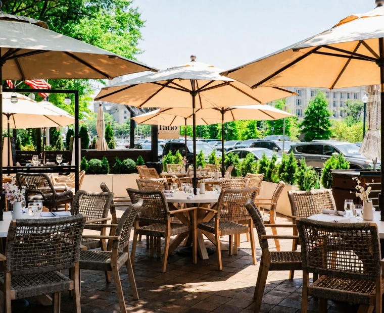 a patio with tables and umbrellas