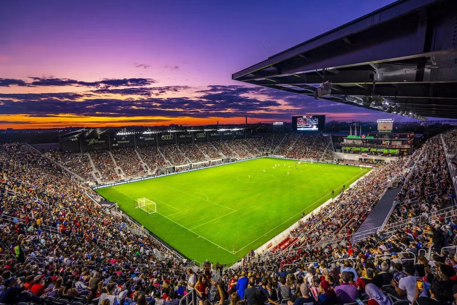 a football stadium with a crowd watching
