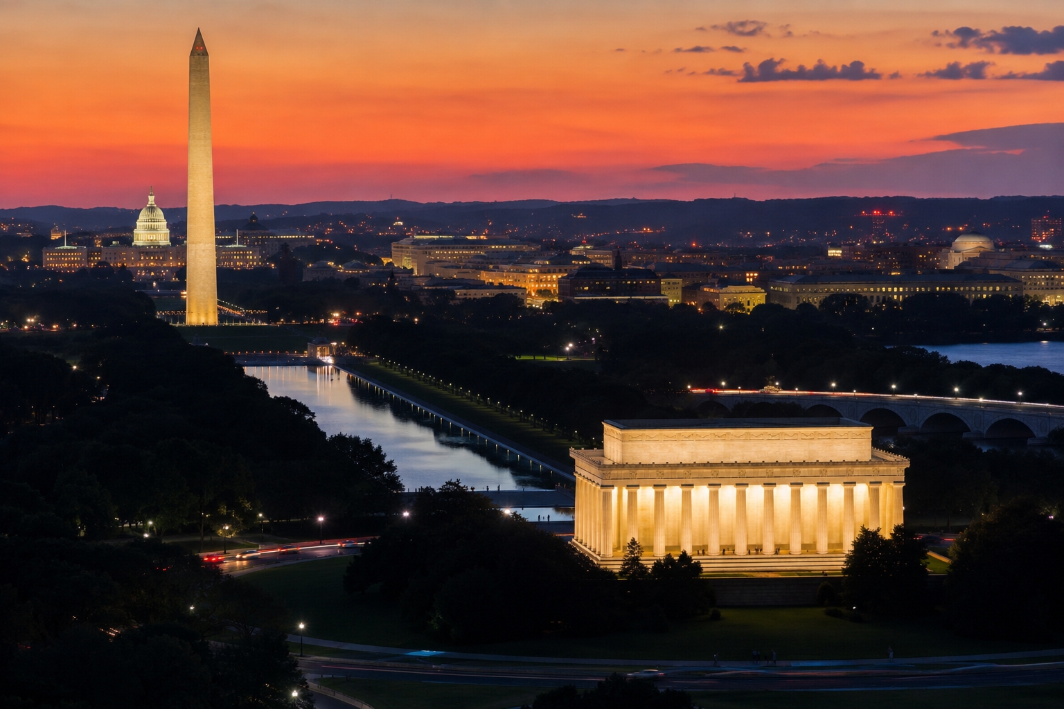 Summer evening in Washington DC with the Washington Monument glowing near the National Mall and the Potomac waterfront