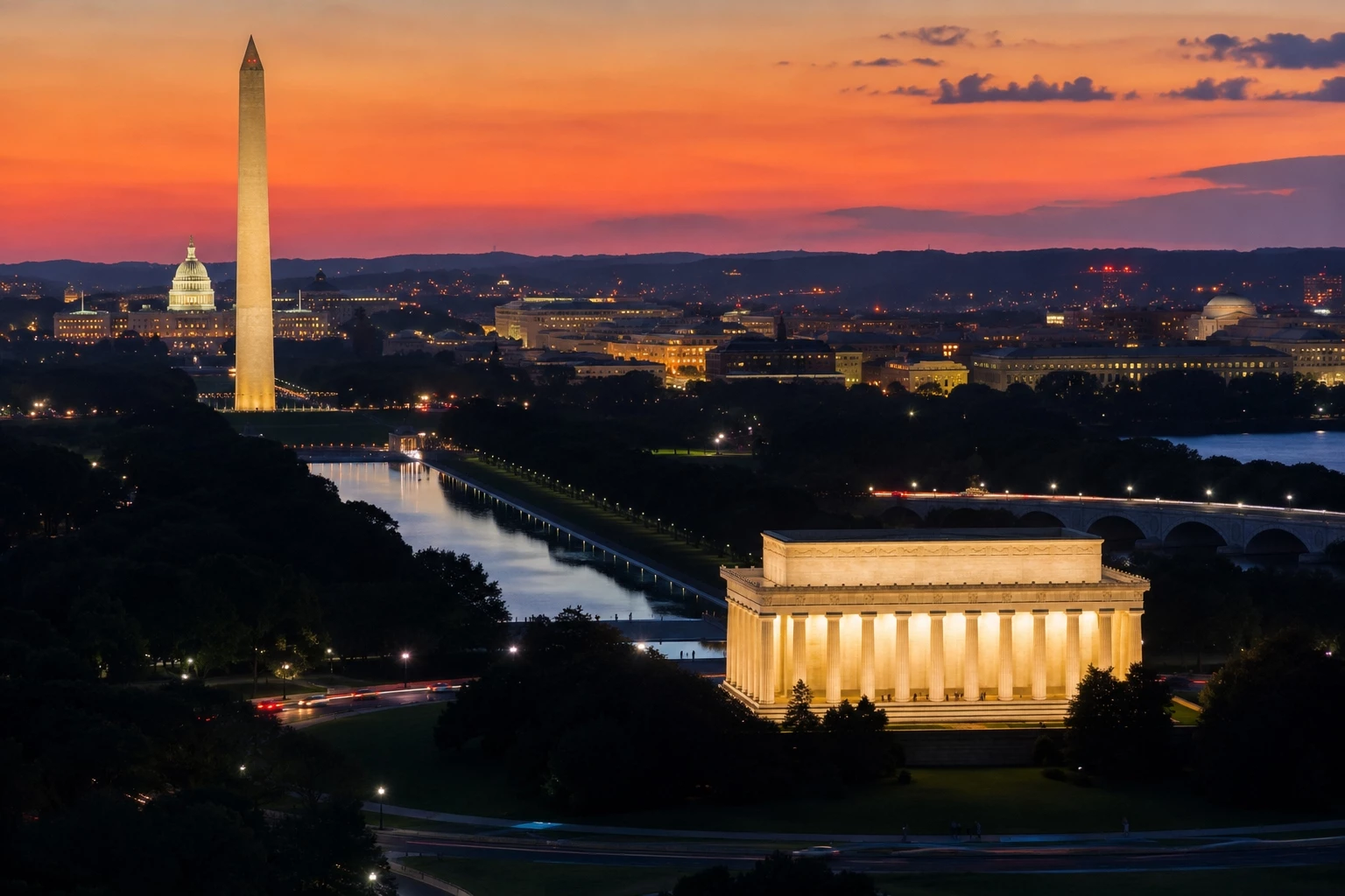 Summer evening in Washington DC with the Washington Monument glowing near the National Mall and the Potomac waterfront