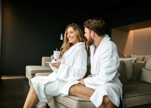 Couple in their robes, at the spa 