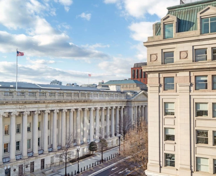 a building with columns and a flag
