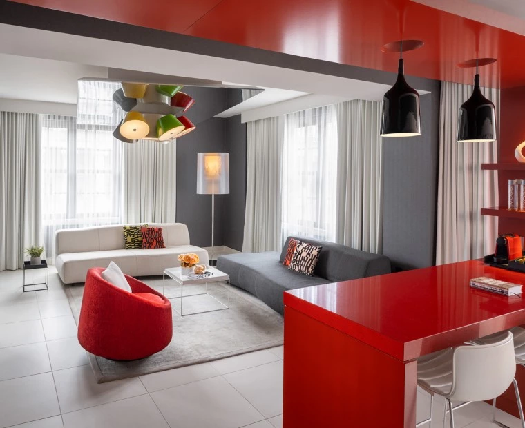 hotel suite with red and white fixtures
