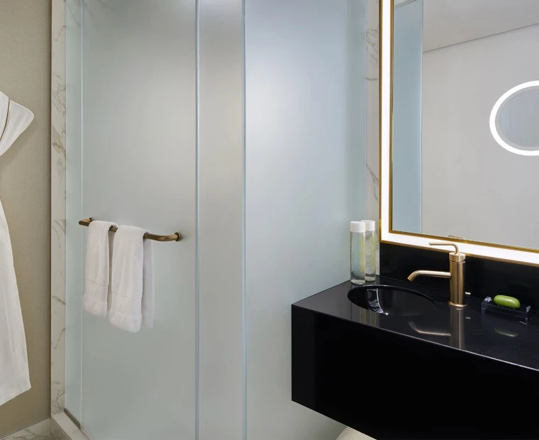 a bathroom with a rope on a hanger