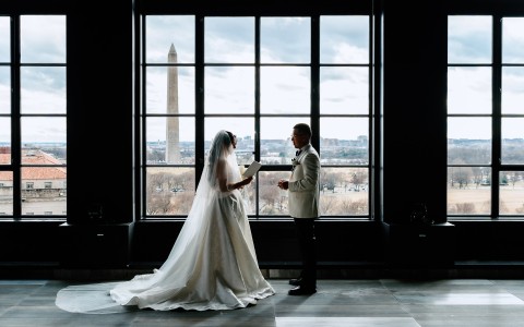 a bride and groom looking at each other