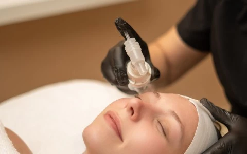 a woman getting a facial treatment