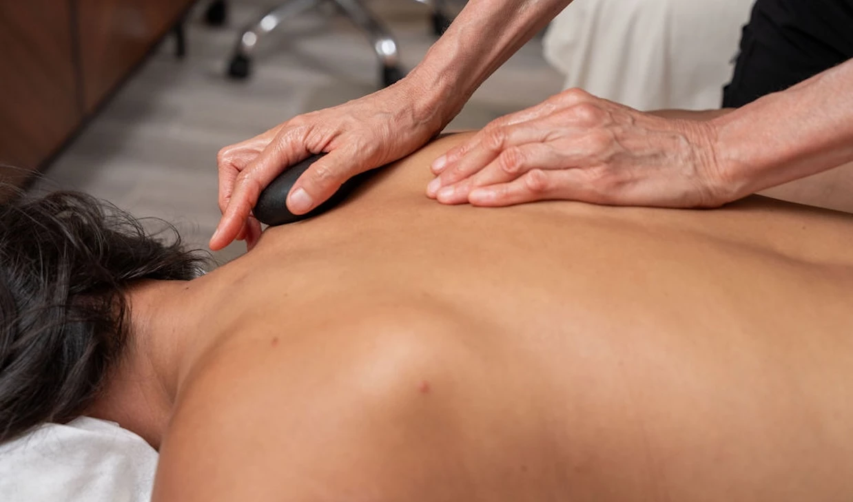 a person massaging a back