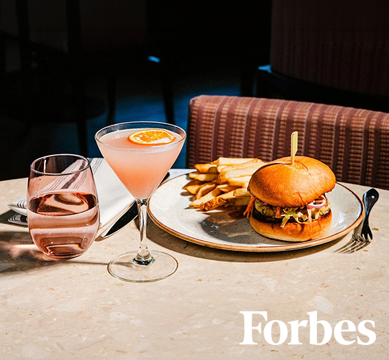 a plate of food and a drink on a table