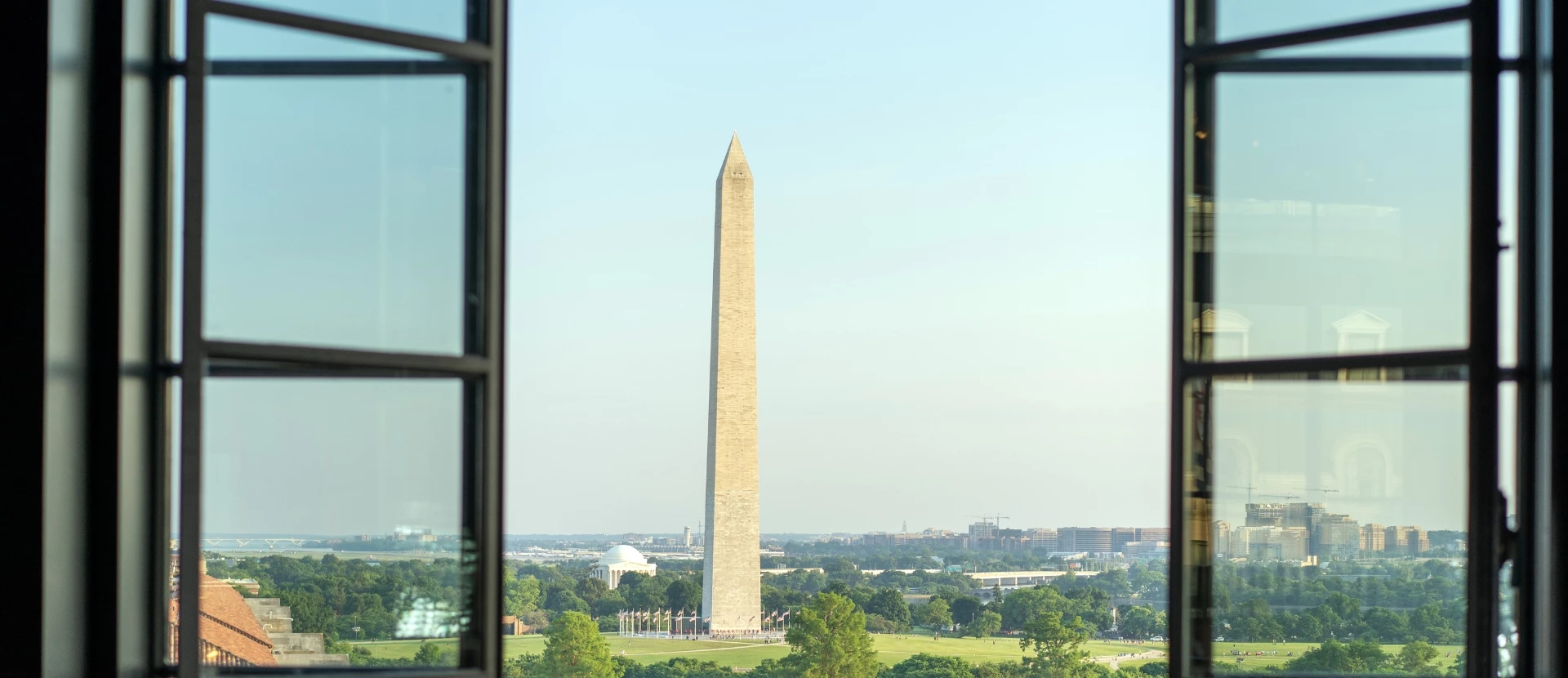 view of the washington monument through large open windows