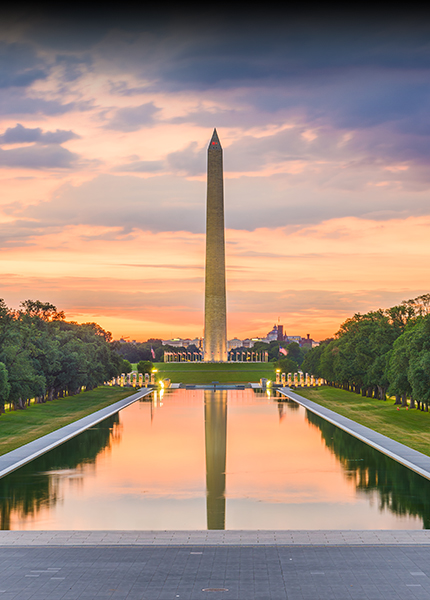 a large monument with a body of water in front of it