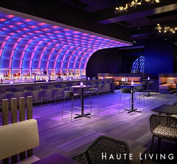 a bar with high top chairs and tables