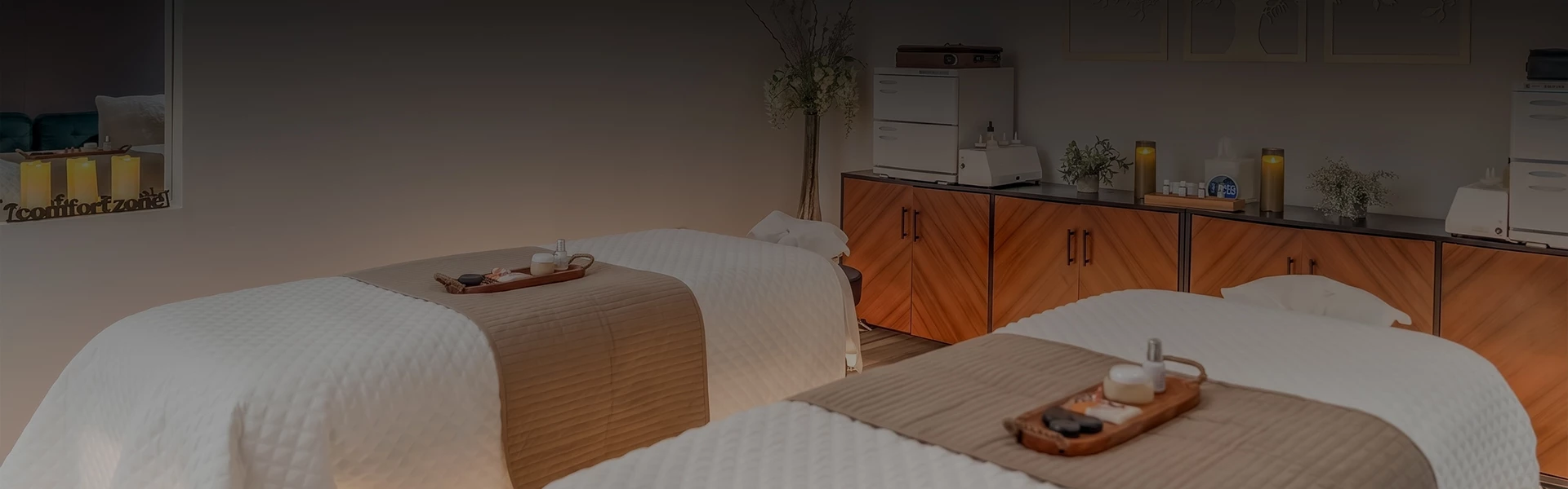 a room with two beds and a cabinet
