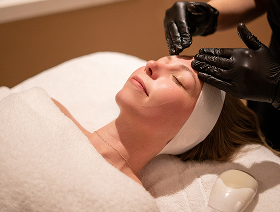 a woman getting a facial massage