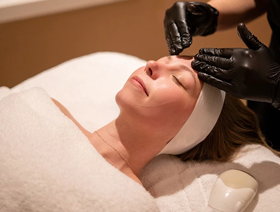 a woman getting a facial massage