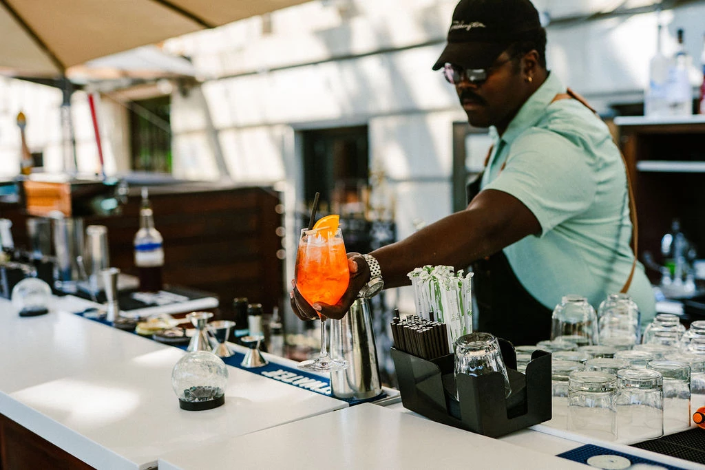 a man holding a drink