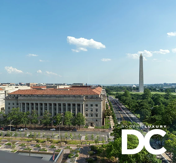 a building with a monument in the background