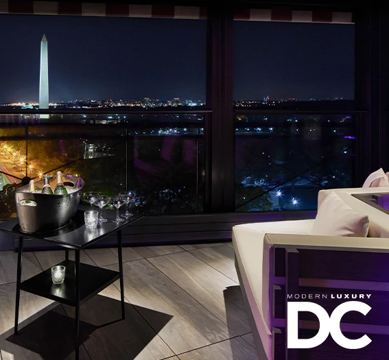 a room with a large window and a large white monument