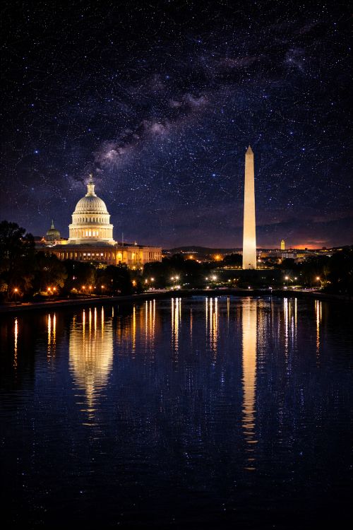 Illuminated U.S. Capitol and Washington Monument reflecting in the Potomac River under a starry night sky in Washington DC