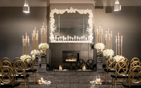 a room with a fireplace and candles