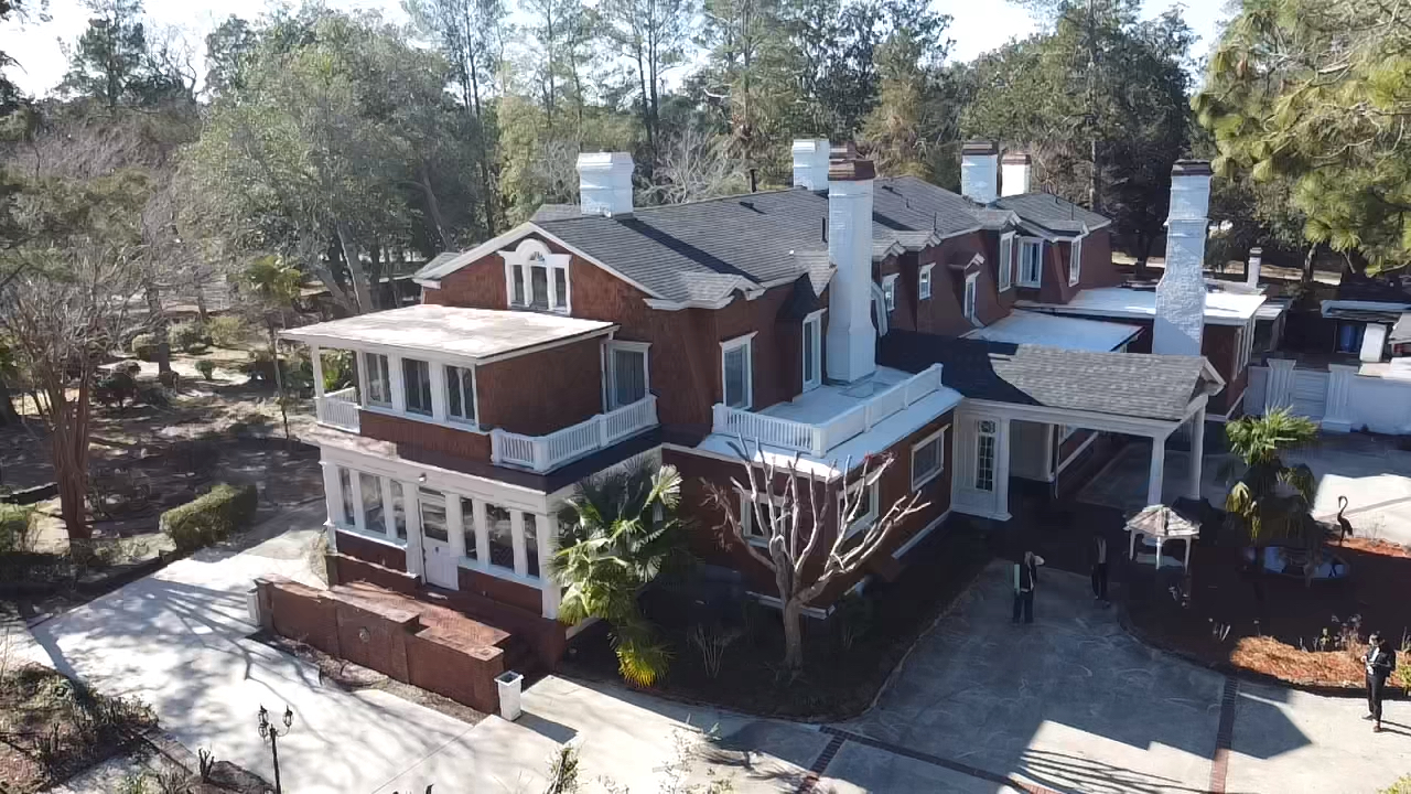 a large brick house with a large chimney