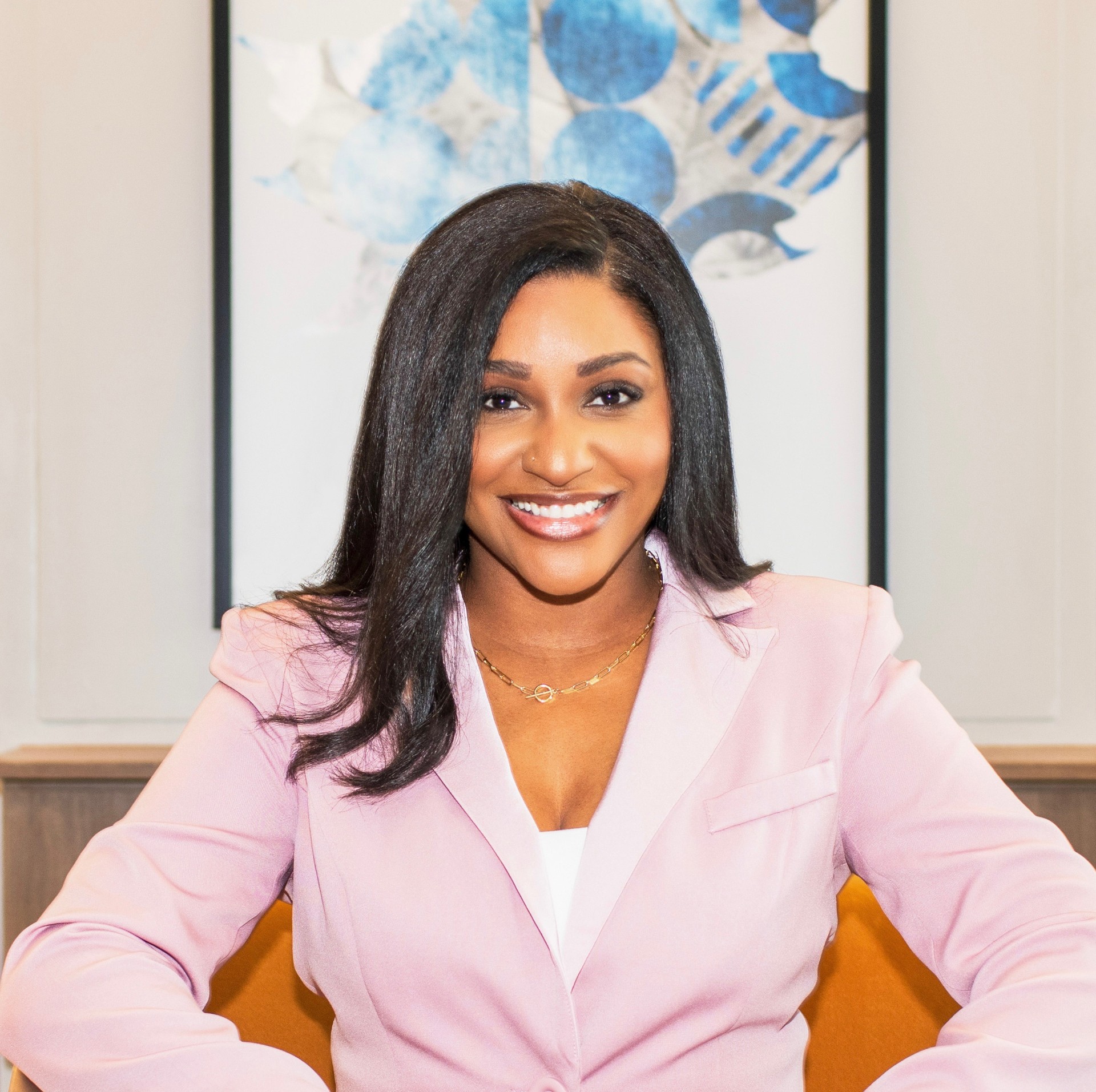 a woman in a pink suit