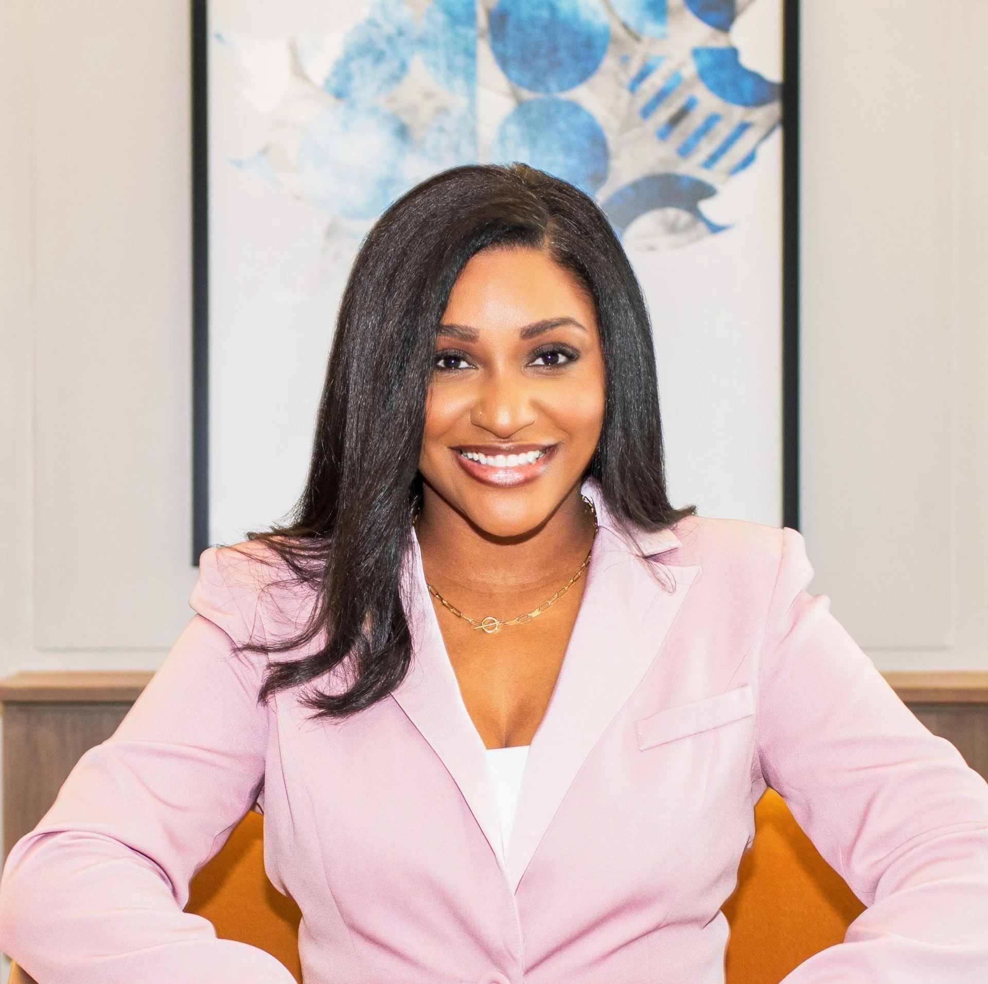 a woman in a pink suit