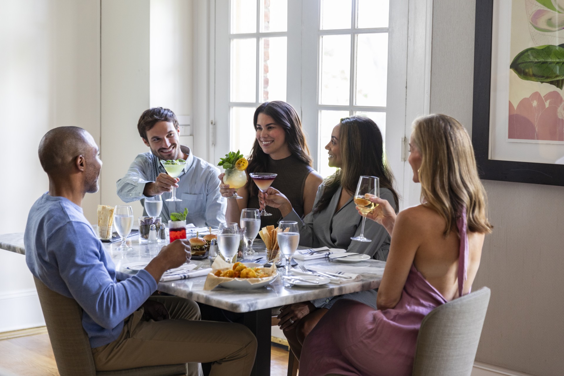 a group of people sitting around a table