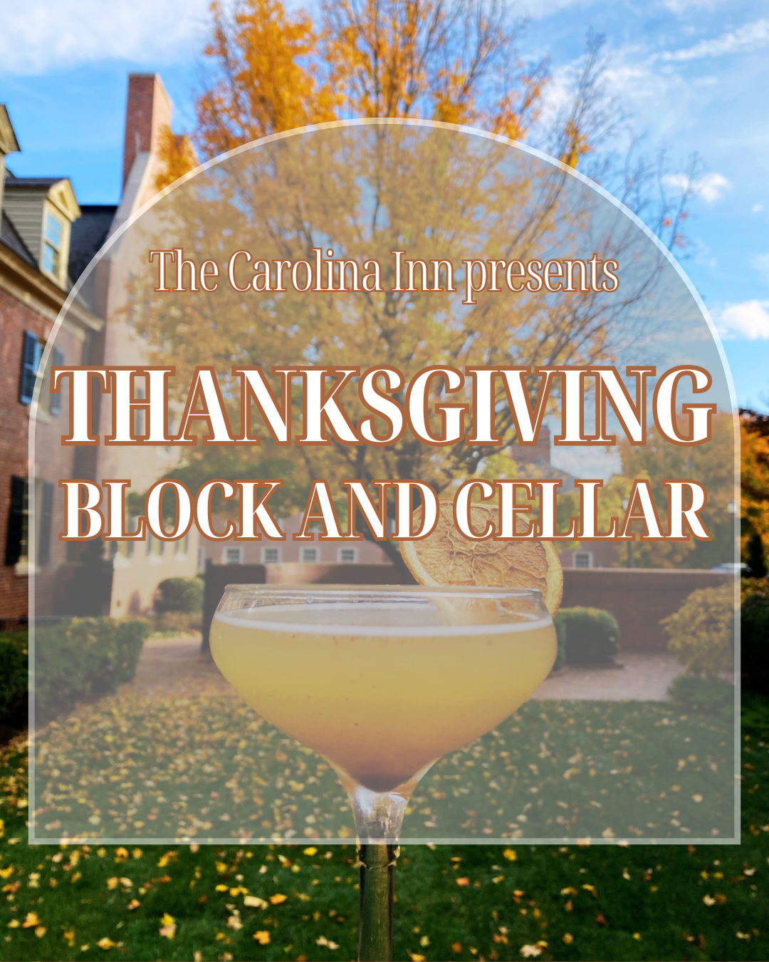 a glass of yellow liquid in front of a house