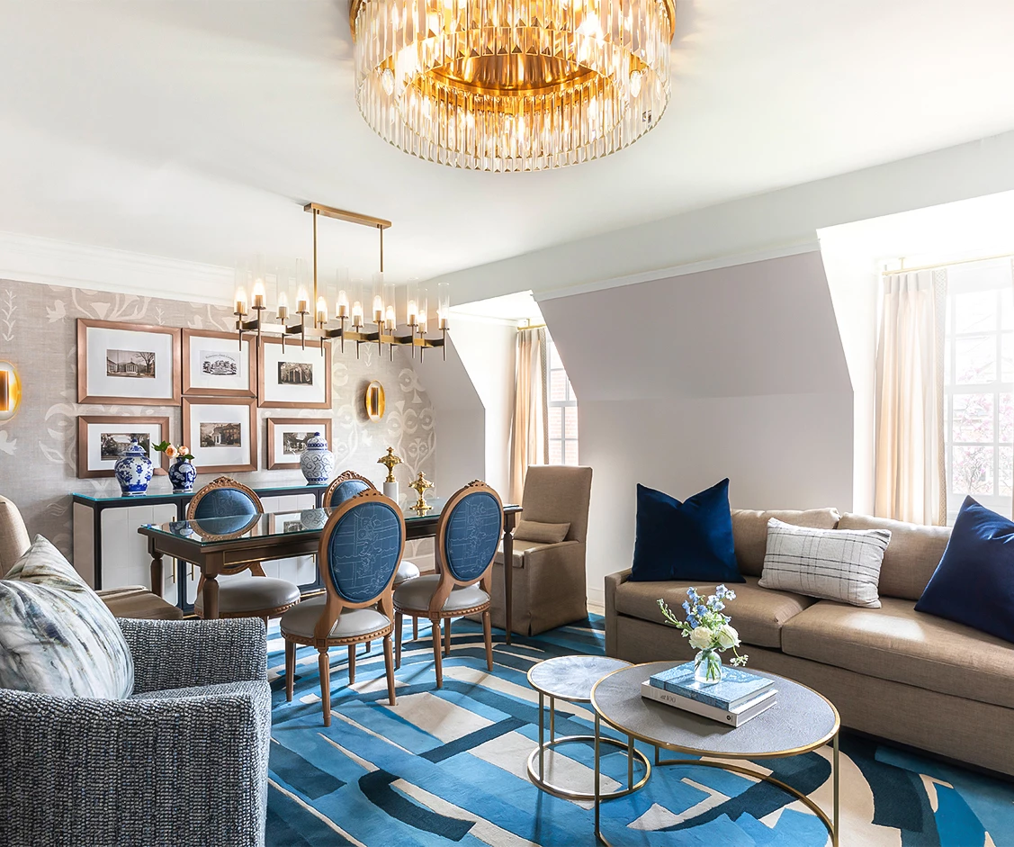 a living room with a chandelier and couches